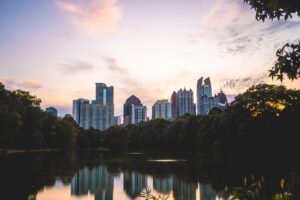 body of water near trees and buildings during daytime in Atlanta