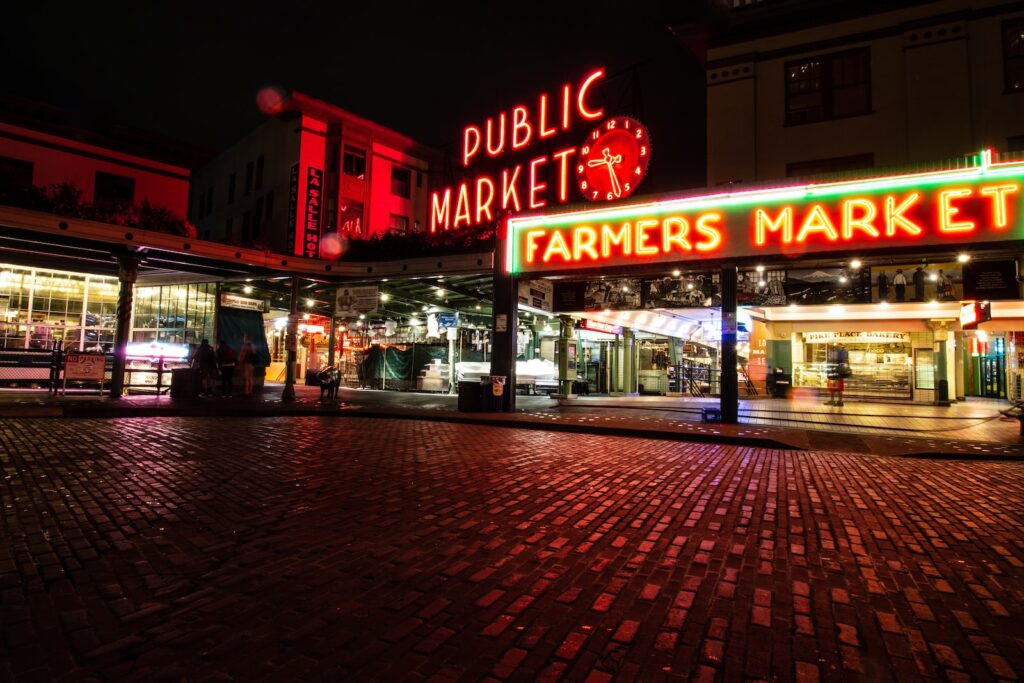 Neon signs at Pike Place Market in Seattle at night
